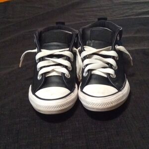 Brand is Converse.    Size is 13